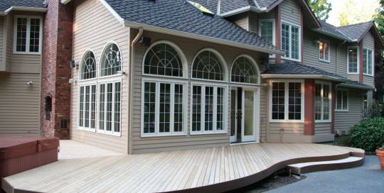 A house with a deck and a patio.