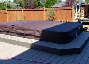 Pool covered with a brown tarp in winter to protect it and avoid risks