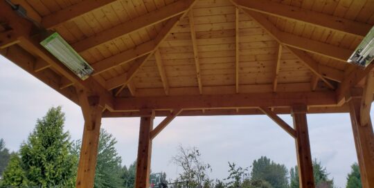 a wooden pergola covering an area